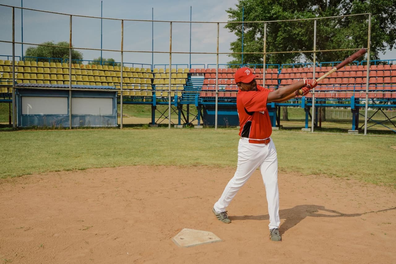 Youth baseball player at the plate holding a bat to check size and fit