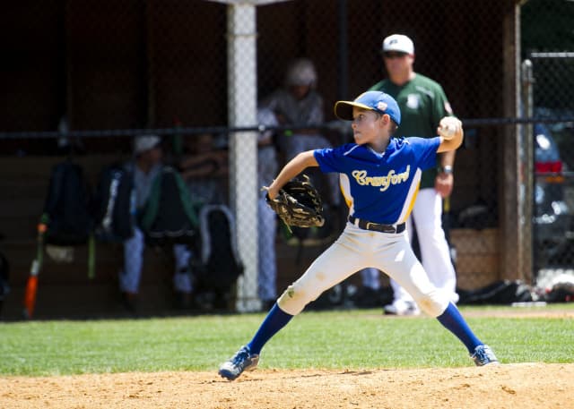 Youth baseball player demonstrating throwing mechanics