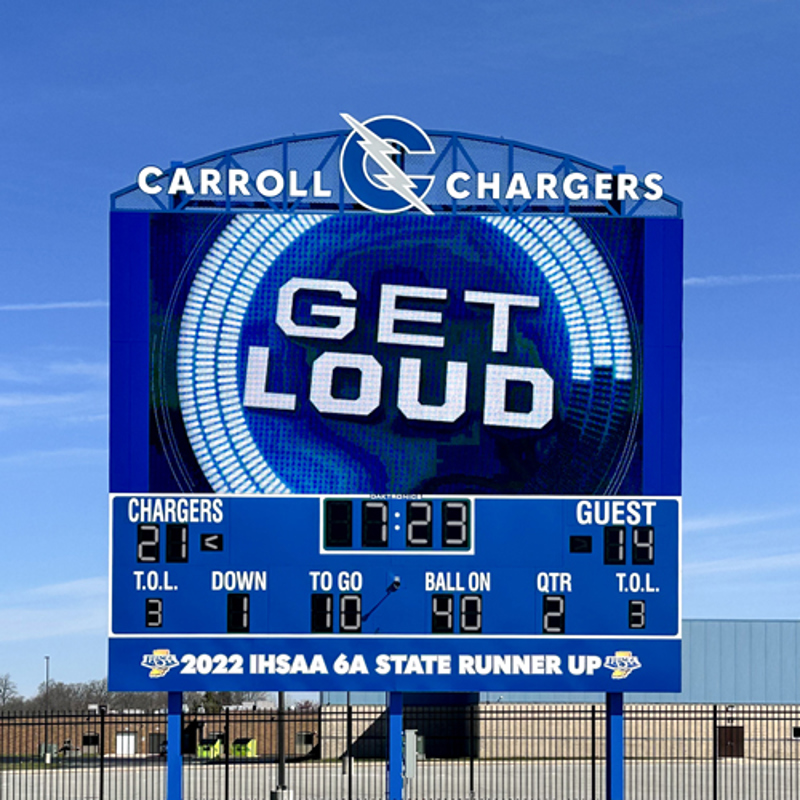 Daktronics LED baseball scoreboard installation at a high school baseball field showing full color video display and scoring panels