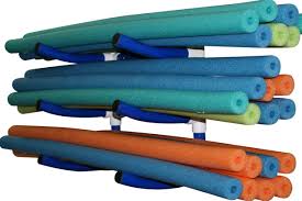 DIY pool noodle bat holder zip-tied to a chain-link fence holding youth baseball bats upright as a budget dugout organization hack