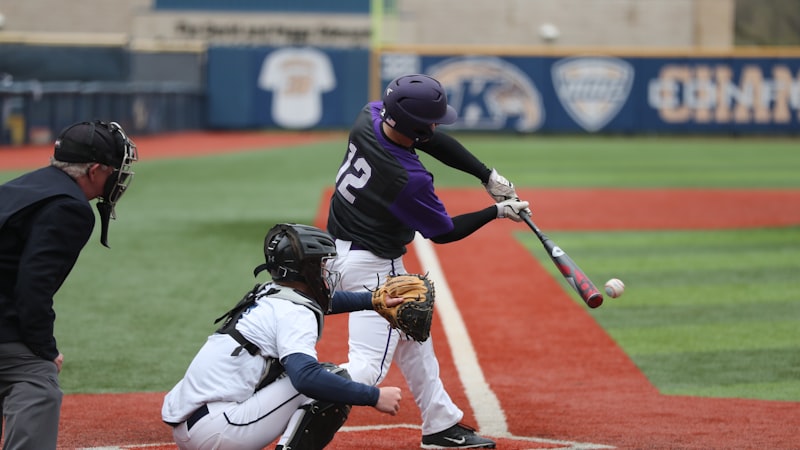 Youth baseball team taking batting practice at an outdoor facility