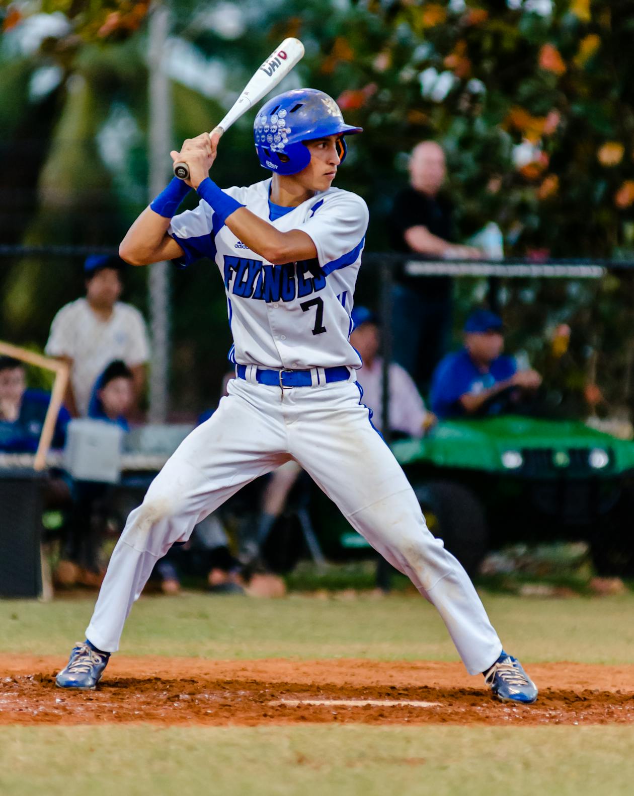 Youth baseball player setting up in a balanced batting stance at the plate before a pitch