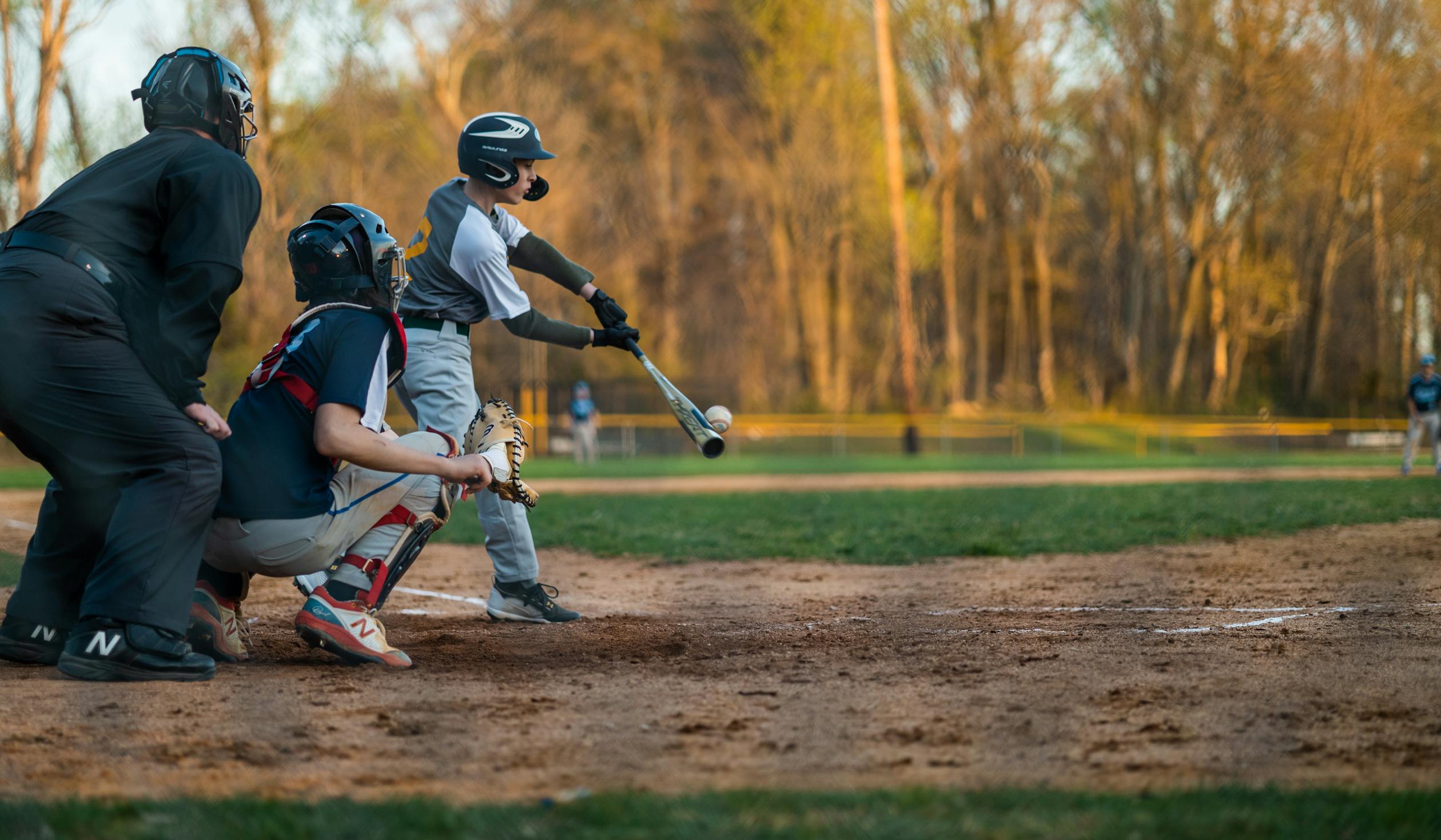 Youth baseball hitter making solid barrel contact with the ball during batting practice